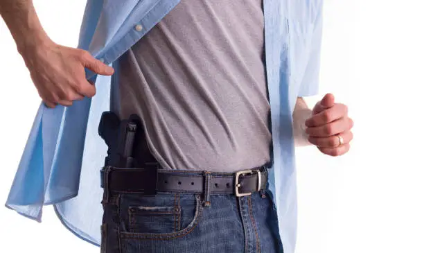 man conceal carrying a weapon on his belt